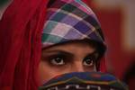 A Kashmiri woman attend during a day-long token hunger strike organised by the Jammu Kashmir Liberation Front (JKLF) in Srinagar February 26, 2011. JKLF, a separatist party fighting for the complete independence of Kashmir both from India and Pakistan, organised a day-long hunger strike on Saturday in Srinagar to highlight what JKLF said are the continuous human rights violations by the Indian security forces on Kashmiri people. According to Ghani, her mother was allegedly killed by Indian secur