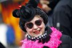 Carnival reveller in costume participates during a carnival parade in Berlin