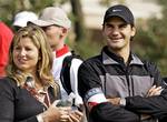 Tennis player Roger Federer, right, watches the match of Tiger woods with her girl friend Mirka Vavrinec at the 2006 HSBC Champions golf tournament Thursday Nov. 9, 2006 at Sheshan Golf Club in Shanghai, China. The same two players who closed out the 2005 Tennis Masters Cup will open this year's version of the season-ending championships. Roger Federer will meet David Nalbandian in the opening Red Group match Sunday at Qizhong Stadium. Nalbandian beat No. 1 Federer in the Masters Cup final last