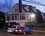 Law enforcement officers stand outside another residence of Amine El Khalifi in Arlington, Va., Friday, Feb., 17, 2012.