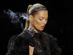 British model Kate Moss smokes a cigarette while modeling a creation by American fashion designer Marc Jacobs for Louis Vuitton's Fall-Winter, ready-to-wear 2012 fashion collection, during Paris Fashion week, presented in Paris, Wednesday, March. 9, 2011.