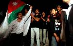 Protesters shout anti-government slogans as they demonstrate at the Jordanian Martyr Statue, demanding and end to corruption, the expulsion of the Prime Minister Marouf al-Bahkit and political reform in Amman, Jordan, Friday Aug. 5, 2011.