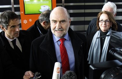 Herman Nackaerts, center, Deputy Director General and Head of the Department of Safeguards of the International Atomic Energy Agency, IAEA, is interviewed as he arrives after his flight from Iran at Vienna's Schwechat airport, Austria, on Wednesday Feb. 22, 2012. The top U.N. nuclear official says his team could "could not find a way forward" in attempts to persuade Iran to talk about suspected secret work on atomic arms. Herman Nackaerts of the International Atomic Energy Agency says the talks in Tehran were inconclusive, although his mission approached the talks "in a constructive spirit." (AP Photo/Ronald Zak)