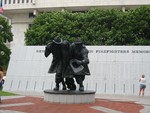 The New York State Fallen Firefighters Memorial. Crossing through the plaza is the South Mall Arterial, a short highway artery connecting to the Dunn Memorial Bridge. Construction of this highway destroyed many buildings in Albany's downtown. In the initial proposal, the highway was to go from Interstate 90 in North Green bush (current exit 8 to NY 43), through Rensselaer, under the plaza, and connecting to the also-can celled Mid-Crosstown Arterial, which would have run from I-90 Exit 6, through the city, traveling underneath Washington Park, meeting with the South Mall Expressway in the process,