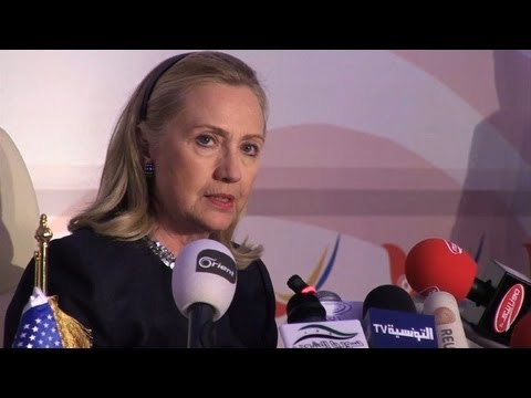 Clinton warns Assad of 'heavy cost' of crackdown