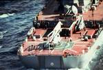 A view of the helicopter pad on the stern of the Soviet Kirov class nuclear-powered guided missile cruiser KALININ with a Ka-25 Hormone helicopter and a Ka-27 Helix helicopter aboard.