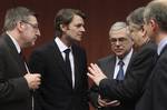 Greek Finance Minister Evangelos Venizelos, second right, speaks with from left, Belgium's Finance Minister Steven Vanackere, French Finance Minister Francois Baroin and Greek Prime Minister Lucas Papademos during a round table meeting of eurozone finance ministers at the EU Council building in Brussels on Monday, Feb. 20, 2012.