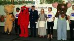 LOS ANGELES, Calif. (May 30, 2003)--First Book and National Book Bank distribute books to inner-city children. The Coast Guard provides warehouse space for the books during transit and distribution. Many books distributed are a childs first book. SA J.D. Peacock presented childrrens books at the Book Expo along with many story-book characters at the Los Angeles Convention Center, May 30th. USCG photo by PA3 Dave Hardesty (90474) ( FIRST BOOK (FOR RELEASE) )