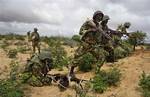 FILE - In this Oct. 20, 2011 file photo, African Union peacekeepers are seen in the Deynile district of the capital Mogadishu, Somalia. Intensified fighting in Somalia has underscored that tiny Burundi, one of only two African nations contributing troops to a peacekeeping force in the anarchic nation, is bearing a heavy burden with dozens of its soldiers reportedly killed in recent clashes. (AP Photo/Ali Bashi, File)