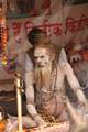 Indian Sadhu, or Hindu holy rest at a temporary camp at Babughat in Kolkata on 05 Jan 2012. Thousands of Hindu pilgrims taka holy dip at Gangasagar, hoping to wash away sins and others to secure a fine spouse, in a sun-worshipping tradition older than Hinduism itself in Eastern India City