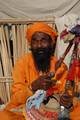 Indian Sadhu, or Hindu holy rest at a temporary camp at Babughat in Kolkata on 05 Jan 2012. Thousands of Hindu pilgrims taka holy dip at Gangasagar, hoping to wash away sins and others to secure a fine spouse, in a sun-worshipping tradition older than Hinduism itself in Eastern India City