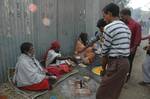 Indian Sadhu, or Hindu holy rest at a temporary camp at Babughat in Kolkata on 05 Jan 2012. Thousands of Hindu pilgrims taka holy dip at Gangasagar, hoping to wash away sins and others to secure a fine spouse, in a sun-worshipping tradition older than Hinduism itself in Eastern India City