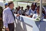 The chief of the United Nations Mission in Haiti Mariano Fernandez speaks with students. Military contingents from the United Nations Mission in Haiti joined forces to hold a CIMIC day for local residents and students in Haiti's capital Port au Prince's Bel Air neighbourhood. Doctors, dentists and engineers were in attendance at an all girls school, providing medical and dental attention and cleaning the surrounding streets of garbage and debris. Photo Logan Abassi UN/MINUSTAH