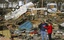 People try to salvage what they can after a tornado destroyed homes in their neighborhood Wednesday, Feb. 29, 2012, in Harrisburg, Ill.