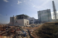 Debris is seen scattered near the Unit 6 reactor building of stricken Fukushima Dai-ichi nuclear power plant in Okuma town, Fukushima prefecture, northeastern Japan Tuesday, Feb. 28, 2012