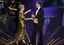 Meryl Streep, left, accepts the Oscar for best actress in a leading role for "The Iron Lady" from Colin Firth during the 84th Academy Awards on Sunday, Feb. 26, 2012, in the Hollywood section of Los Angeles.