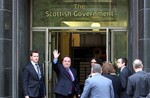 Scotland's First Minister Alex Salmond, second left, arrives for a meeting with Britain's Prime Minister David Cameron,at St Andrew's House in Edinburgh, Scotland Thursday, Feb 16, 2012.