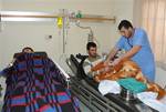 Two of three Syrian injured men who were wounded from the shelling at Baba Amr neighborhood in the Syrian province of Homs, on their hospital beds as they receive treatment, in the eastern town of Chtoura, in Bekaa valley, Lebanon, on Monday Feb. 20, 2012. Lebanese security officials said at least three wounded Syrians were brought for treatment in the eastern town of Chtoura. The officials, who spoke on condition of anonymity in line with regulations, said the wounded came from the Baba Amr att