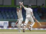 Australia's cricket captain Michael Clarke, left, and batsman Michael Hussey cheer each others as Clarke takes a run to complete his century during the fifth days' play of the third test cricket match between Australia and Sri Lanka in Colombo, Sri Lanka, Tuesday, Sept. 20, 2011.