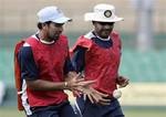 Indian cricketers Zaheer Khan, left, and Virender Shewag play a game to warm up during a practice session in Dambulla, Sri Lanka, Sunday, Aug. 17, 2008. The five one day international cricket series between Sri Lanka and India will begin tomorrow Aug. 18, 2008.