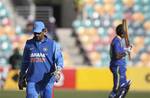 India's captain MS Dhoni ponders his team's fortunes as Sri Lanka scored 320 in their one day international cricket match in Hobart, Australia, Tuesday, Feb. 28, 2012