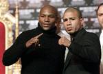 Boxers Floyd Mayweather, left, and Miguel Cotto pose during a news conference in New York, Tuesday, Feb. 28, 2012. Cotto and Mayweather will fight in Las Vegas on May 5, 2012 for Cotto's WBA World super welterweight title.. (AP Photo/Seth Wenig)