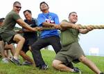 ance Cpl. Steve Martinez, right, leads fellow U.S. Marines and Sailors from the Royal Brunei Navy in a tug-of-war during a Cooperation Afloat Readiness and Training (CARAT) Brunei 2009 sports day.