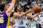 Minnesota Timberwolves' Ricky Rubio, right, of Spain, lays up as Los Angeles Lakers' Pau Gasol, also of Spain, defends in the first half of an NBA basketball game on Friday, March 9, 2012, in Minneapolis. (AP Photo/ Jim Mone)