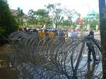 Police put up barbed wire around the courtyard of the building Batam mayor on November 24,2011