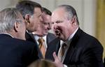 Conservative talk radio host Rush Limbaugh, right, talks with former Defense Secretary Donald H. Rumsfeld, left, in the East Room of the White House in Washington, Tuesday, Jan. 13, 2009, as they arrived for the Presidential Medal of Freedom ceremony for Colombian President Alvaro Uribe, former British Prime Minister Tony Blair and former Australian Prime Minister John Howard. From left to right are: Rumsfeld, Sen. Mel Martinez, R-Fla., Edward W. Gillespie, counselor to President George W. Bush