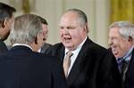 Conservative talk radio host Rush Limbaugh talks with former Defense Secretary Donald H. Rumsfeld, left, in the East Room of the White House in Washington, Tuesday, Jan. 13, 2009, as they arrived for the Presidential Medal of Freedom ceremony for Colombian President Alvaro Uribe, former British Prime Minister Tony Blair and former Australian Prime Minister John Howard. From left to right are: Sen. Mel Martinez, R-Fla., Rumsfeld, Edward W. Gillespie, counselor to President George W. Bush and a fo