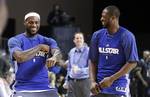 Miami Heat's LeBron James, left, does a dance move as he stands with teammate Dwyane Wade during practice for the NBA All Star basketball game, Saturday, Feb. 25, 2012, in Orlando, Fla. (AP Photo/Lynne Sladky)