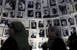 In this Aug. 18, 2010 file photo, Palestinian students visit the Hall of Names at the Yad Vashem Holocaust memorial during their tour in Jerusalem. Six decades after the German Nazis murdered 6 million Jews, Israel's national Holocaust memorial has launched a new effort to educate the country's Arab minority, many of whom either deny the horror or undermine its scope.