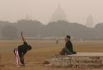 India man exercise on a foggy morning in Kolkata on Wednesday,21 January 2011 Thick fog across East India