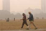 India oldman walk on a foggy morning in Kolkata on Wednesday,21 January 2011 Thick fog across East India