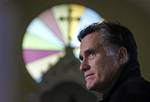 Republican presidential candidate, former Mass. Gov. Mitt Romney pauses during a visit to St. Paul's Lutheran Church while campaigning in a Berlin, N.H. neighborhood, Thursday Dec. 22, 2011. (AP Photo/Charles Krupa)