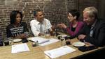 President Barack Obama and first lady Michelle Obama have dinner with grassroots supporters Judy Glassman, a retired school administrator from Cambridge, Mass., and Mitch Glassman, an artist from Cambridge, Mass., at Boundary Road Restaurant in Washington, Thursday, March 8, 2012. (AP Photo/Susan Walsh)