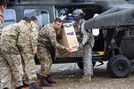 Soldiers from U.S. Army Europe's 12th Combat Aviation Brigade conduct a resupply mission to deliver goods to Montenegrins stranded by severe weather in Northern Montenegro on Friday, Feb. 24, 2012. The soldiers are here as part of a U.S. task force to provide humanitarian assistance at request of the government of Montenegro coordinating with the National Emergency Operations Center and the Montenegrin Ministry of Defense to provide relief and to save lives, homes and infrastructure in response