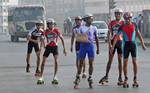 India Boys Sketing on the empty road during the General Strike called by Eleven Central Trade Unions against the anti people economic polices of the Union Goverment at Kolkata on Tuesday 28 February 2012 in Eastern India City