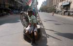 Indian Labour wait for Customer during the General Strike called by Eleven Central Trade Unions against the anti people economic polices of the Union Goverment at Kolkata on Tuesday 28 February 2012 in Eastern India City