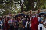 Thousands of devotees from Bhutan, India, Japan, Nepal, China, Hong Kong, Tibet, Himalayan regions and other countries like europe and America carrying traditional scarfs awaiting their spiritual leader's arrival at Bodhgaya, Bihar State of India