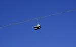 Shoes hanging from a telephone wire in Gothenburg, Sweden. Shoe flinging or 