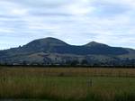 Saddle Hill from the Taieri Plains, showing the shape which gives the hill its name. East to the left. Saddle Hill is a prominent landmark overlooking the northeastern end of the Taieri Plains in Otago, New Zealand.