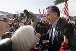 FILE - In this Jan. 19, 2012 file photo, Republican presidential candidate, former Massachusetts Gov. Mitt Romney, and South Carolina Gov. Nikki Haley, greet supporters at his campaign headquarters in Charleston, S.C. Romney faces a tough sell in the Deep South. With Mississippi and Alabama primaries coming up next Tuesday, there’s concern that he’s too slick, not really a conservative. In a region where the evangelical vote is important, some are skeptical about his Mormon faith. But for many S