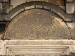 Romanesque tympanum above the south side door of the Gothic St. Nicholas & St. Adalbert parish church.