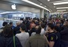 Customers wait for the Apple store to open at the launch of the new iPad tablet computer, in Rome, Italy, Friday, May 28, 2010.