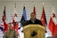 Secretary of Defense Leon Panetta addresses nearly 200 service members, to include soldiers from coalition nations, during a town hall meeting here March 14, 2012.