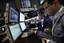 Specialist Donald Civitanova, left, and trader Maier Tarlow work on the floor of the New York Stock Exchange Wednesday, July 28, 2010