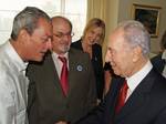 Paul Auster and Rushdie greeting Israeli President Shimon Peres with Caro Llewelyn in 2008.