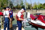 MARLBOROUGH POINT, VA (April 21, 2007) U.S. Coast Guard auxiliarist John Flood (right) of Fredericksburg, VA Flotilla 14-07 (5sr), conducts a Vessel Safety Check on a Personal Watercraft (PWC), owned by Boat/US President and U.S. Coast Guard Auxiliary Honorary Commodore, Richard Schwartz. Meanwhile, auxiliarist and Dick Meyers (left), also of Fredericksburg, VA Flotilla 14-07 (5sr), discusses boating safety with Commodore Schwartz. USCGAUX Photo by Joseph P. Cirone (122492) ( AUXILIARY VESSEL SA